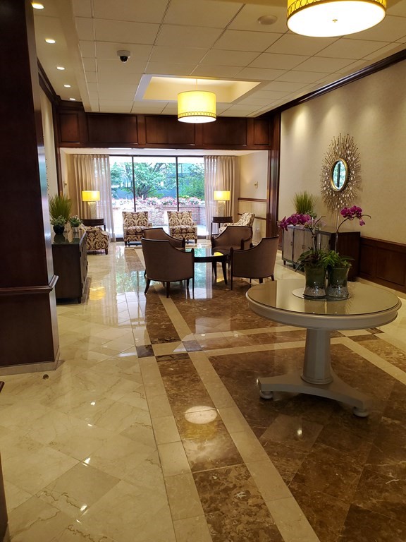 2 Hawthorne Place, Unit 7B Boston, MA 02114 - Photo 10 of 11 a lobby with furniture and a large window