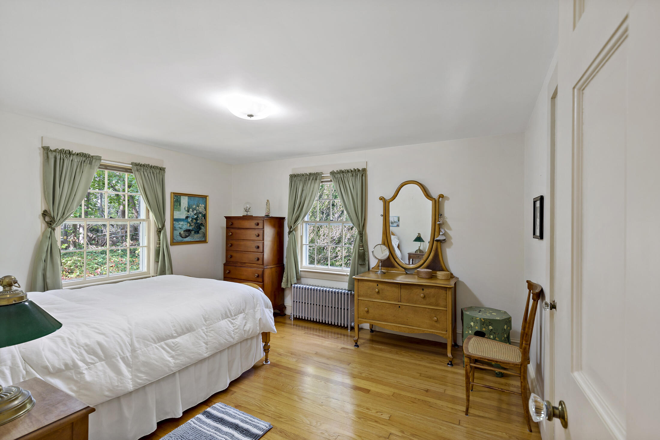 645 Samoset Road Eastham, MA 02642 - Photo 28 of 49 a bedroom with a bed window and a potted plant
