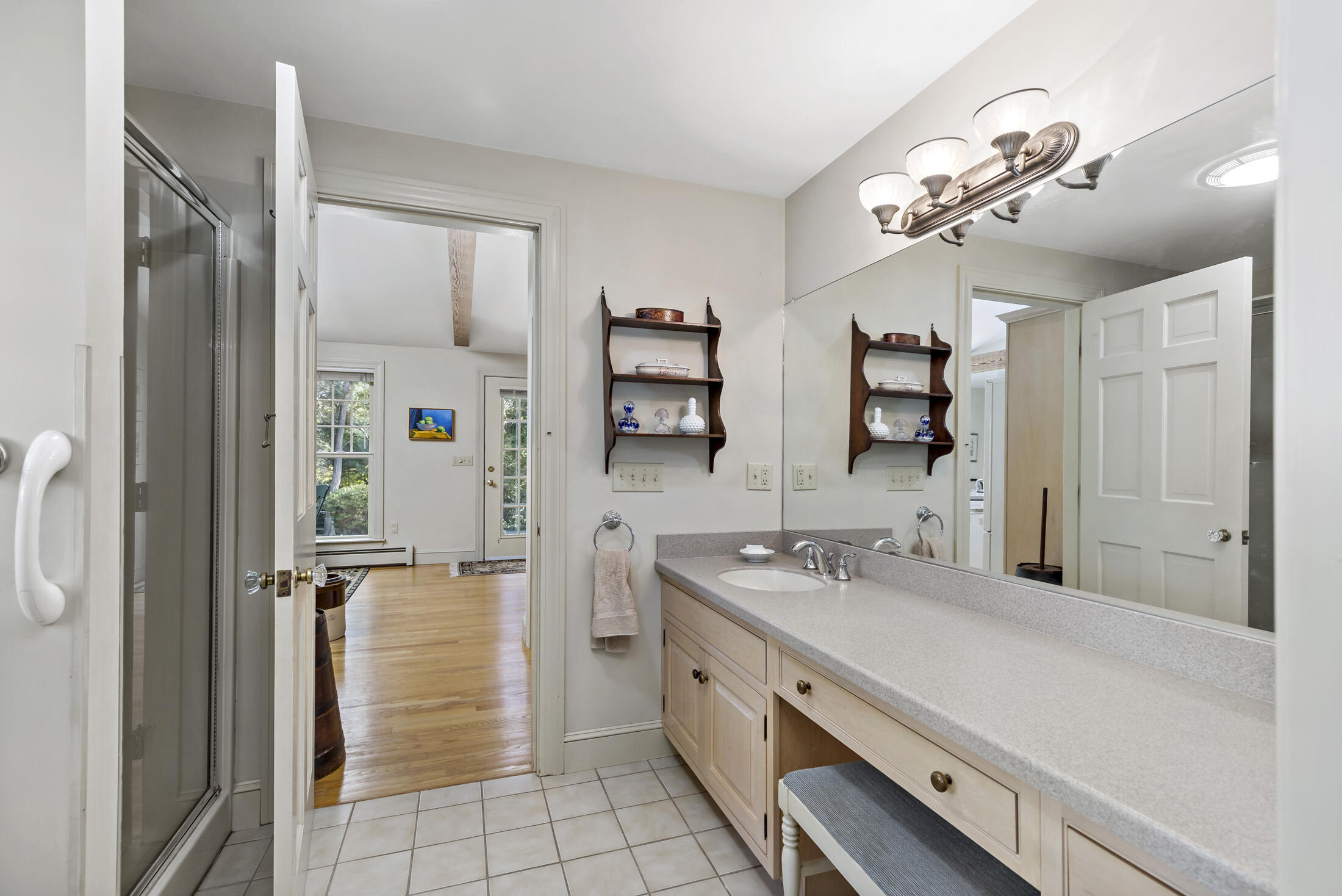 645 Samoset Road Eastham, MA 02642 - Photo 31 of 49 a spacious bathroom with a double vanity sink a mirror and shower