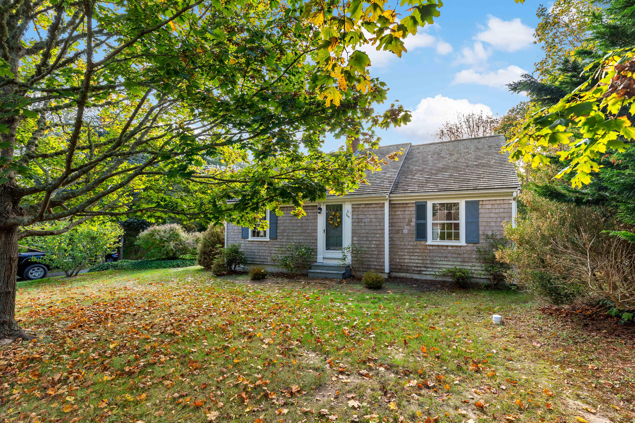 645 Samoset Road Eastham, MA 02642 - Photo 4 of 49 a view of a backyard with a garden