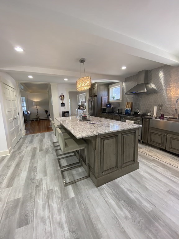 1 Surfside Road Scituate, MA 02066 - Photo 11 of 32 a large kitchen with a large counter top space a sink stainless steel appliances and cabinets
