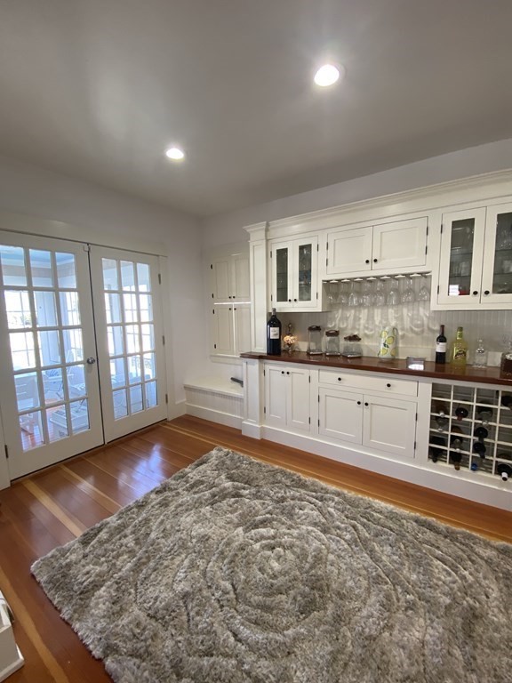 1 Surfside Road Scituate, MA 02066 - Photo 15 of 32 a large kitchen with kitchen island granite countertop a stove a sink and a granite counter tops with white cabinets