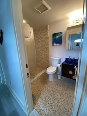 1 Surfside Road Scituate, MA 02066 - Photo 18 of 32 a bath room with a toilet a sink and a mirror