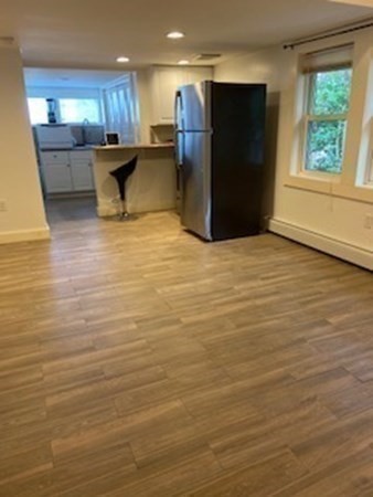 1 Surfside Road Scituate, MA 02066 - Photo 32 of 32 a view of kitchen and empty room with wooden floor