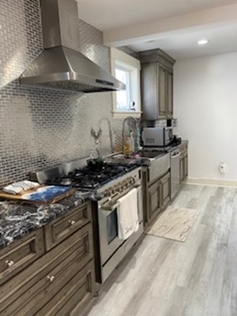 1 Surfside Road Scituate, MA 02066 - Photo 6 of 32 a kitchen with a stove and a sink