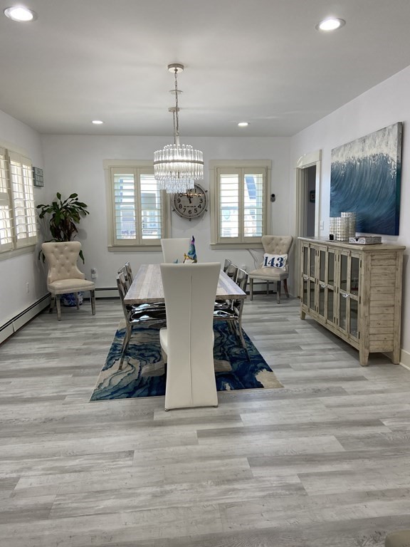 1 Surfside Road Scituate, MA 02066 - Photo 9 of 32 a living room with furniture and a flat screen tv