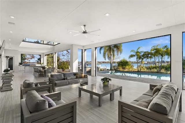 a living room with furniture a rug and a flat screen tv