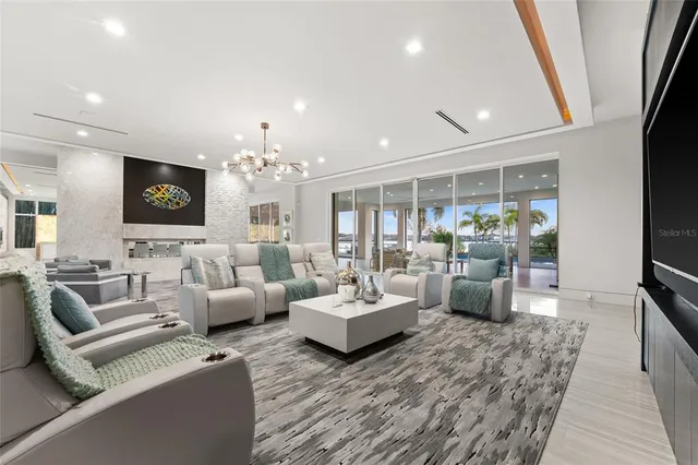 a living room with fireplace furniture and a flat screen tv