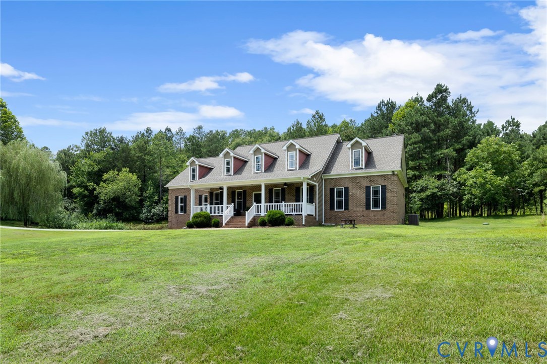 Brick facade residence with a columned front porch