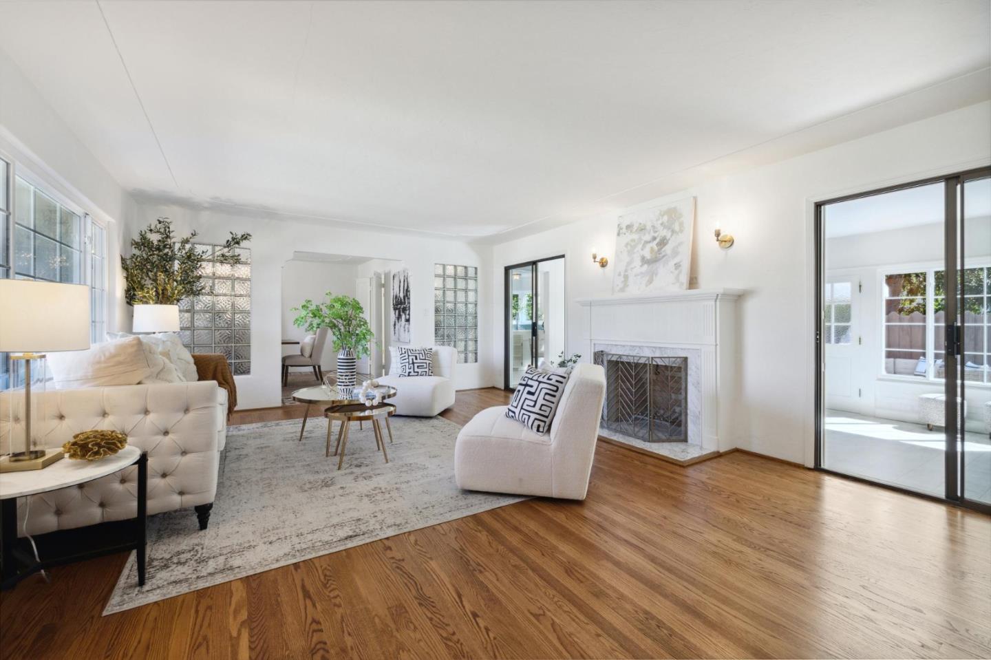 595 Anza Street Mountain View, CA 94041 - Photo 12 of 72 a living room with furniture large window and a fireplace