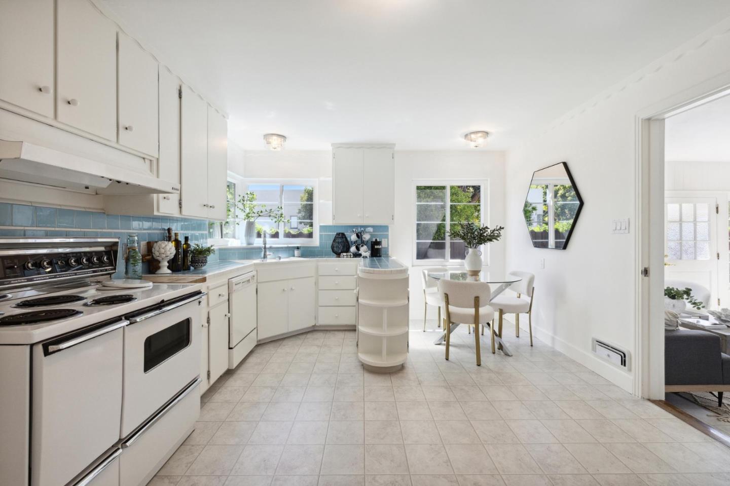 595 Anza Street Mountain View, CA 94041 - Photo 22 of 72 a kitchen with white cabinets and white appliances