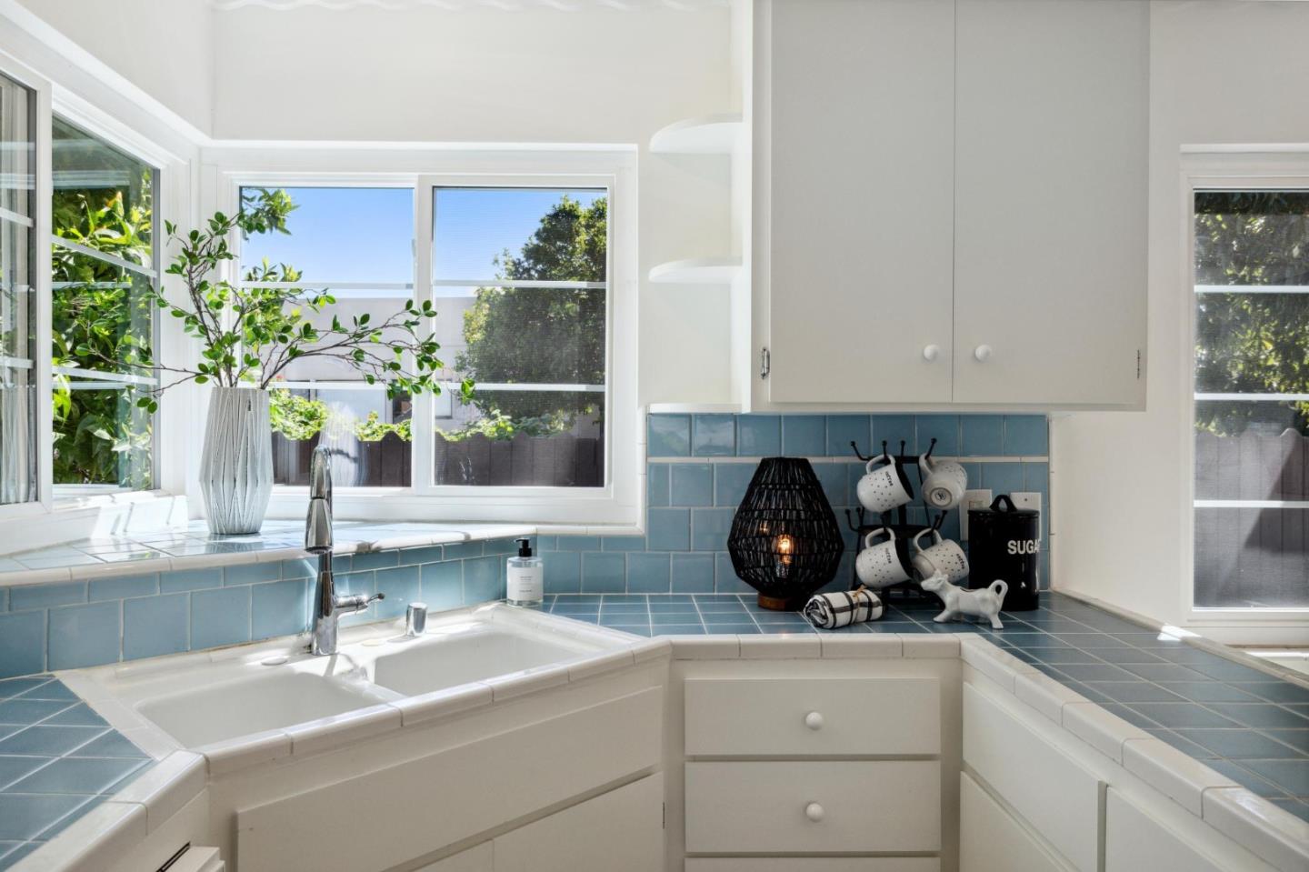 595 Anza Street Mountain View, CA 94041 - Photo 23 of 72 a kitchen with a sink and potted plant