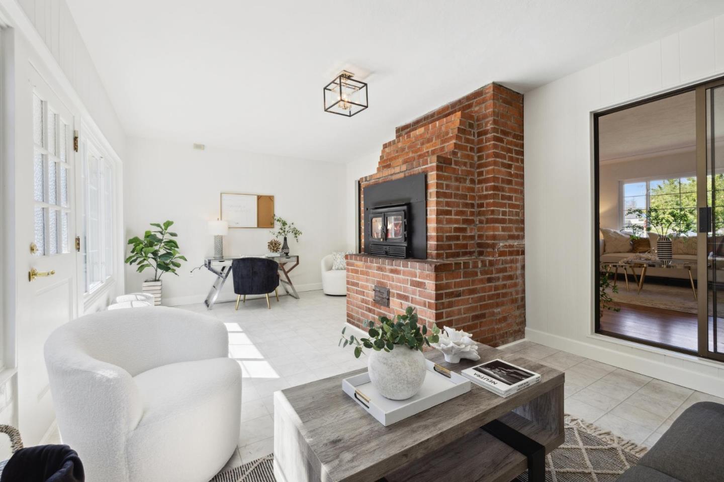 595 Anza Street Mountain View, CA 94041 - Photo 27 of 72 a living room with furniture potted plant and a fireplace