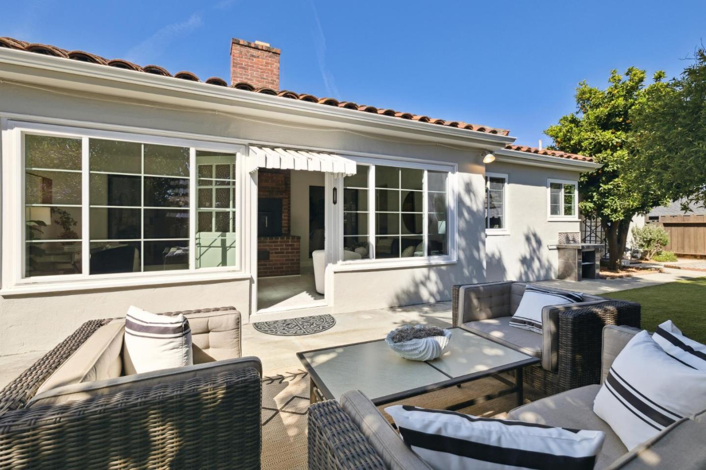 595 Anza Street Mountain View, CA 94041 - Photo 31 of 72 a view of a patio with couches table and chairs and potted plants