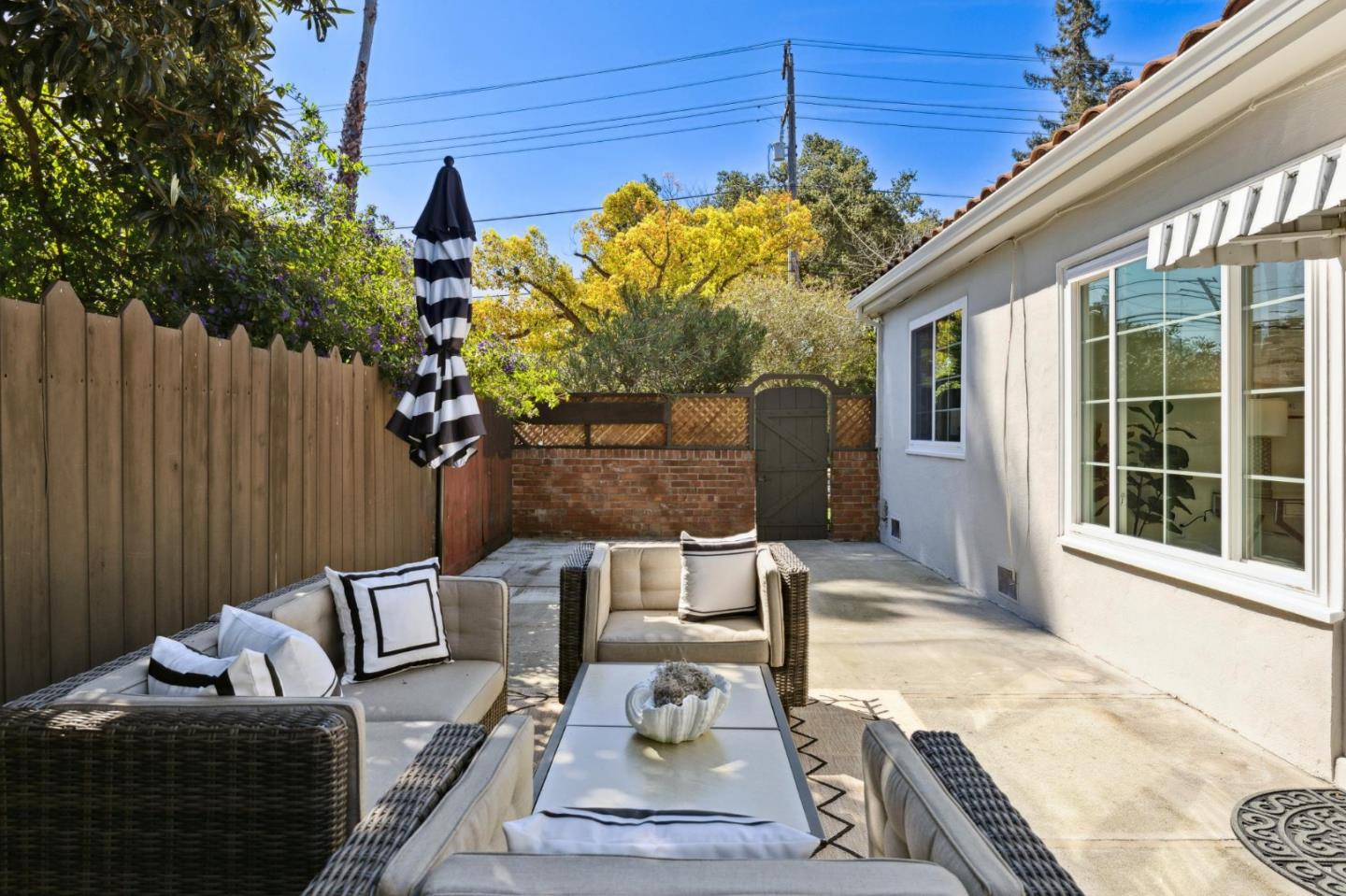 595 Anza Street Mountain View, CA 94041 - Photo 34 of 72 a vase of flowers sitting on a table in front of a window