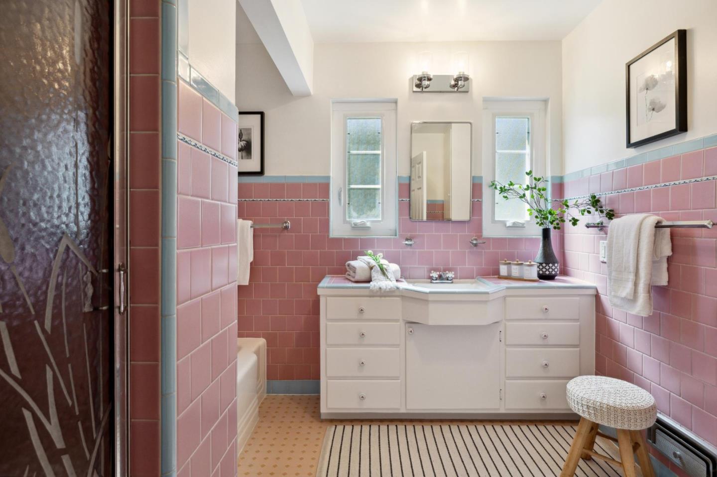 595 Anza Street Mountain View, CA 94041 - Photo 39 of 72 a bathroom with a sink a toilet and mirror