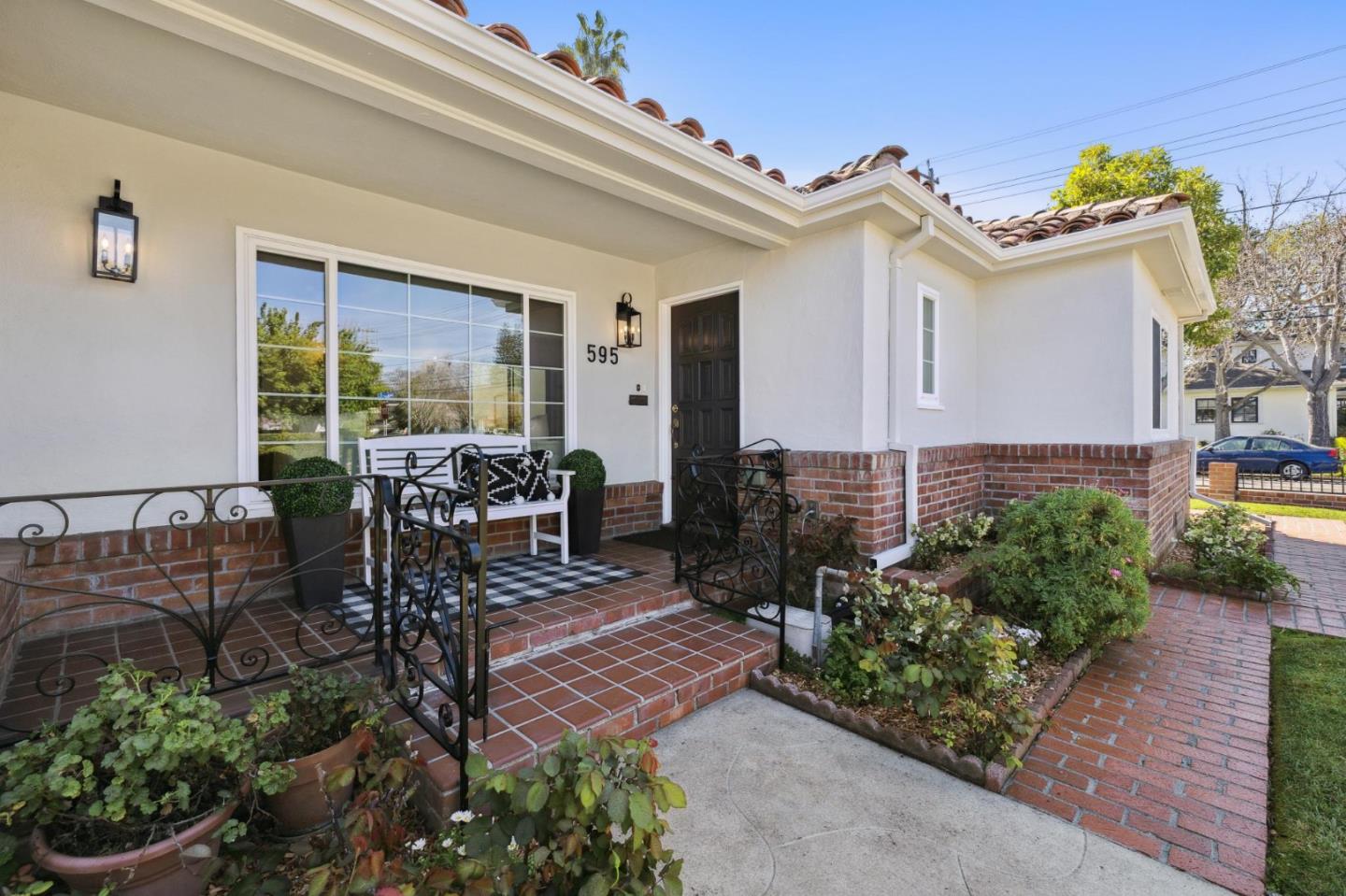 595 Anza Street Mountain View, CA 94041 - Photo 5 of 72 a view of a patio with table and chairs potted plants and floor to ceiling window
