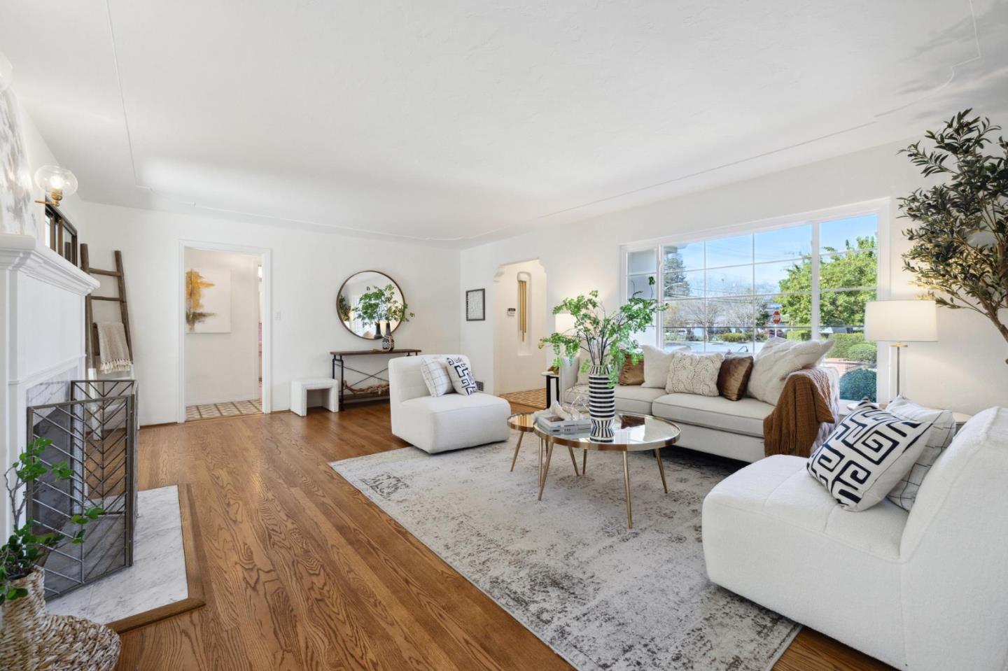 595 Anza Street Mountain View, CA 94041 - Photo 10 of 72 a living room with furniture and a chandelier