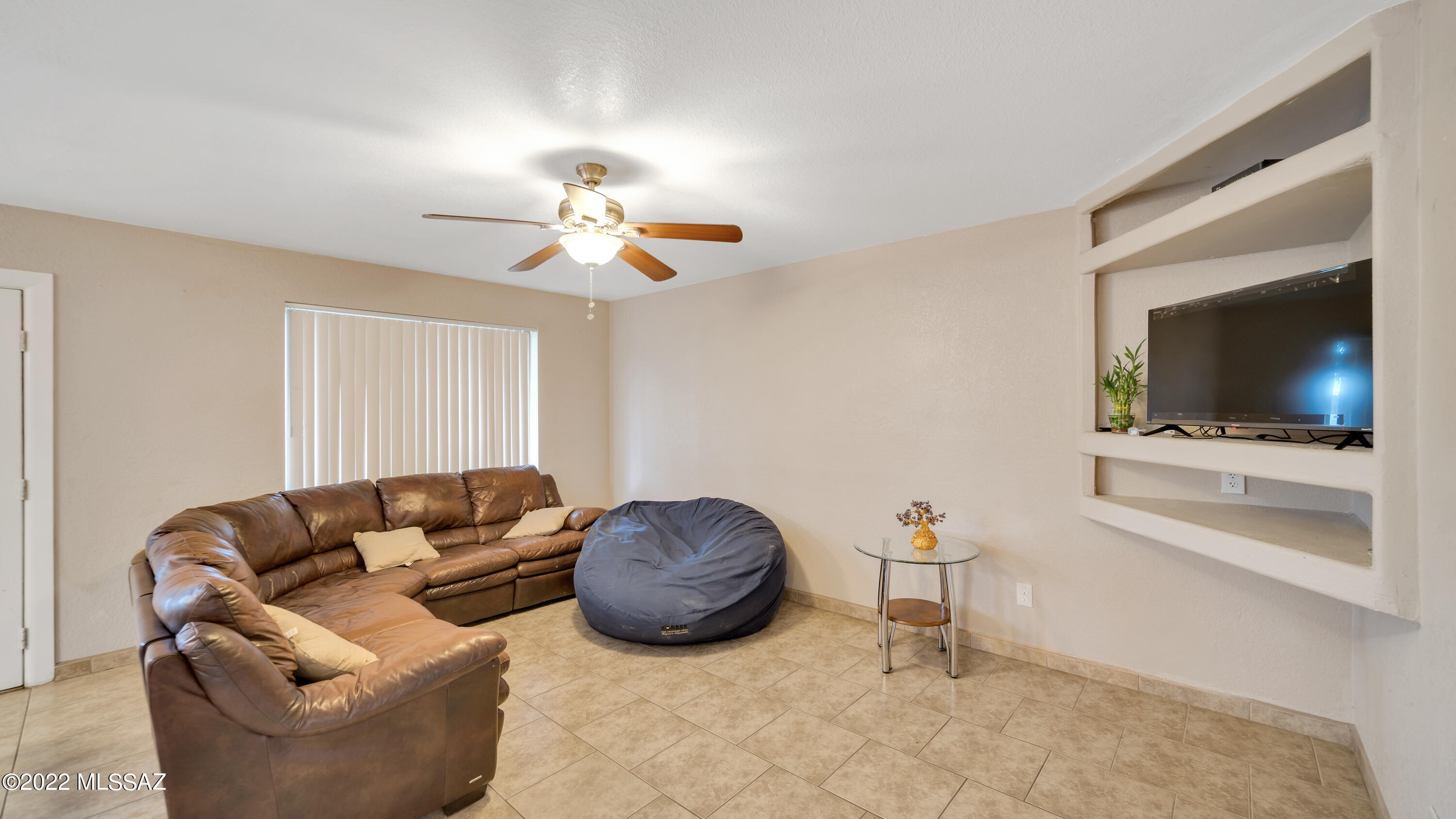 434 Paseo Flamenco Rio Rico, AZ 85648 - Photo 6 of 27 a living room with furniture a flat screen tv and kitchen view