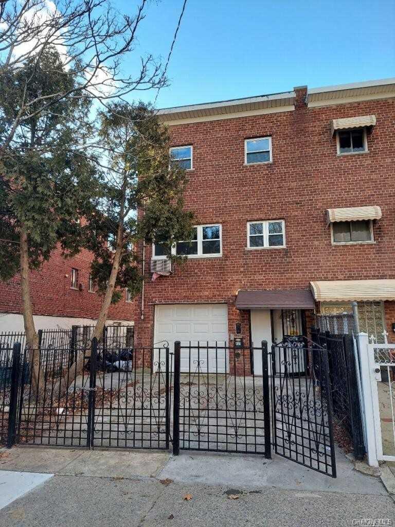 a view of a brick building with many windows