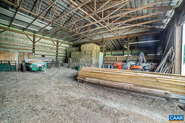 a view of a city with lush green forest