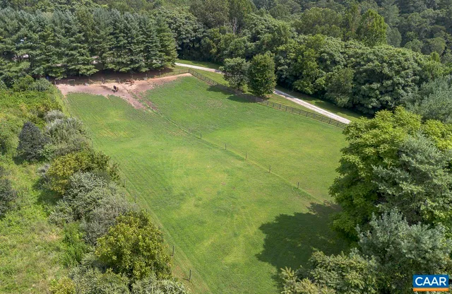 a backyard of a house with lots of green space