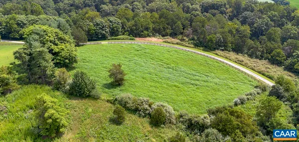 a view of a backyard with side of the road