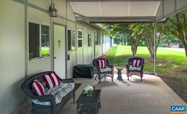 a view of workspace with furniture and window