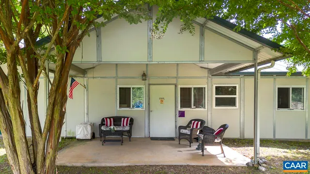 a dining room with furniture and a window