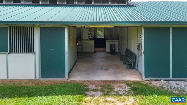 a living room with furniture a fireplace and a window