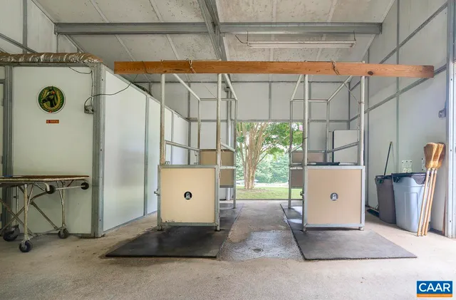 a kitchen with stainless steel appliances a sink window and cabinets
