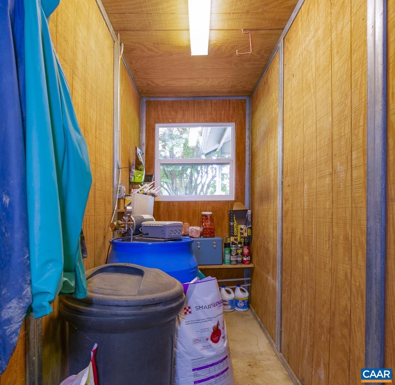 9195 Springwood Road Buchanan, VA 24066 - Photo 48 of 75 a living room with furniture a fireplace and a window