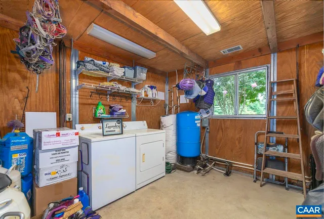 a view of a wooden bridge with large trees