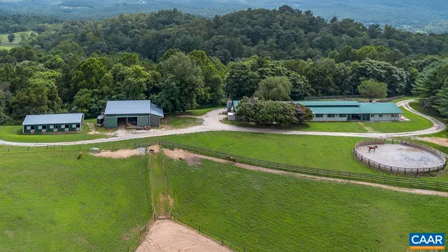 a front view of a house with a garden and yard
