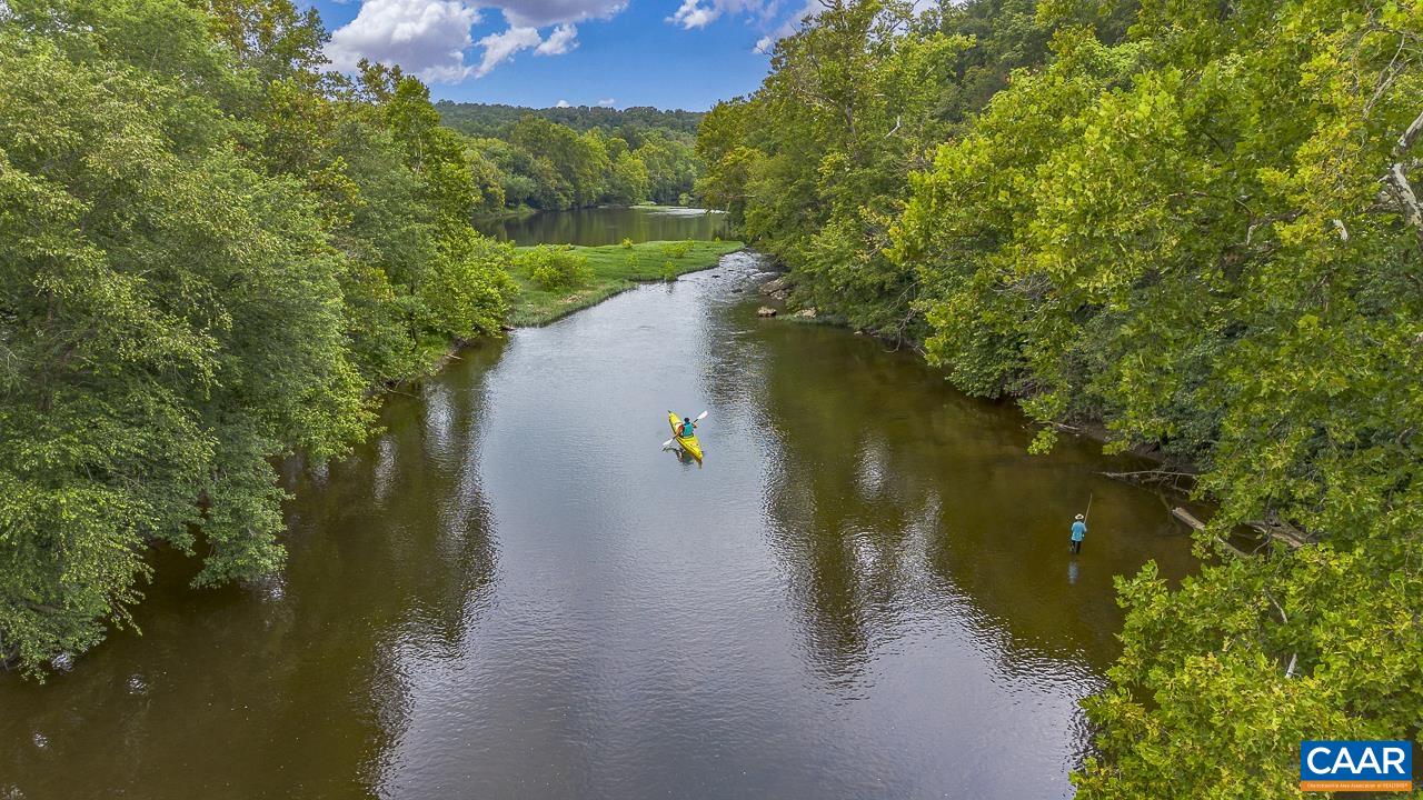 9195 Springwood Road Buchanan, VA 24066 - Photo 68 of 75 a view of a lake with a yard and mountain view