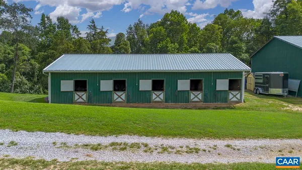 a view of a swimming pool with a yard