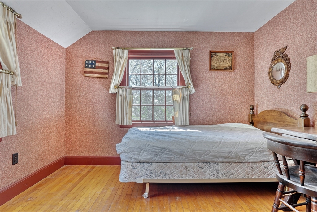 40 Lancaster Drive Westwood, MA 02090 - Photo 13 of 29 a bedroom with a bed and dresser with wooden floor
