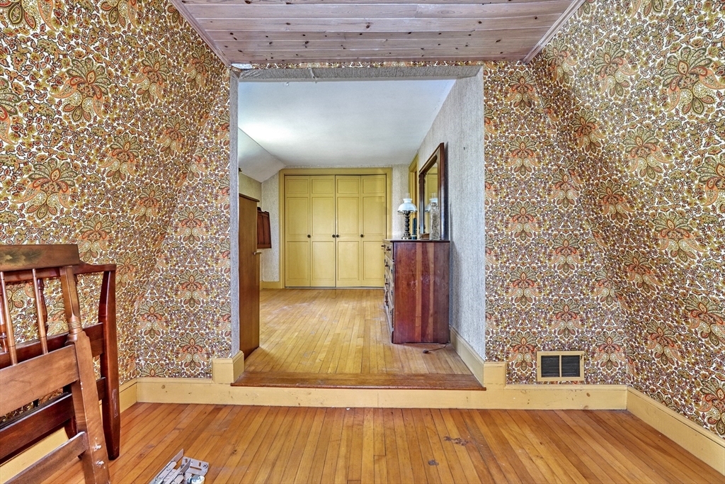 40 Lancaster Drive Westwood, MA 02090 - Photo 16 of 29 a view of a hallway with wooden floor and staircase
