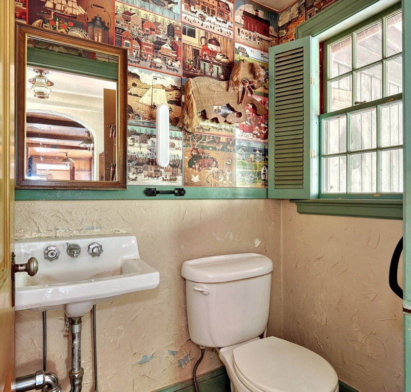 40 Lancaster Drive Westwood, MA 02090 - Photo 17 of 29 a bathroom with a toilet sink and mirror