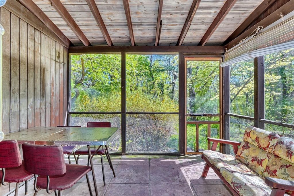 40 Lancaster Drive Westwood, MA 02090 - Photo 21 of 29 a living room with furniture and a floor to ceiling window