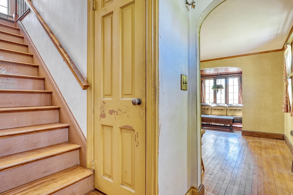 40 Lancaster Drive Westwood, MA 02090 - Photo 3 of 29 a view of staircase with wooden floor and a window
