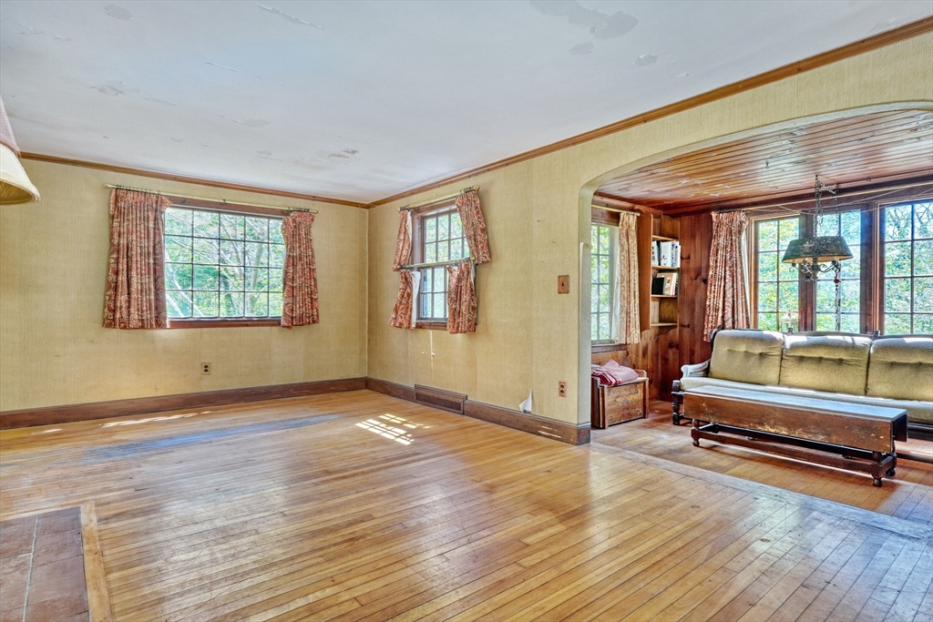 40 Lancaster Drive Westwood, MA 02090 - Photo 4 of 29 an empty room with wooden floor and windows
