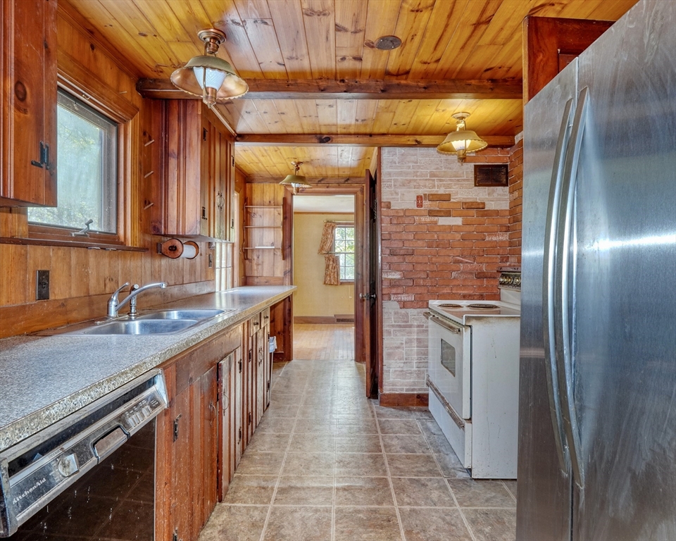 40 Lancaster Drive Westwood, MA 02090 - Photo 7 of 29 a kitchen with stainless steel appliances granite countertop a refrigerator and a sink