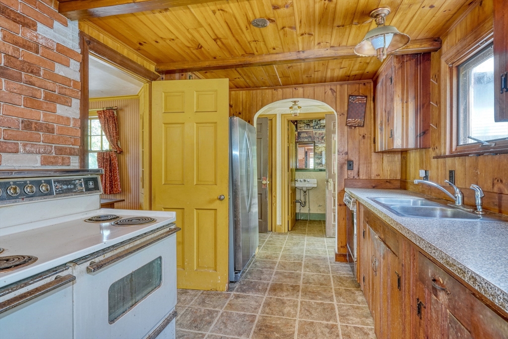 40 Lancaster Drive Westwood, MA 02090 - Photo 9 of 29 a kitchen with a stove and a refrigerator