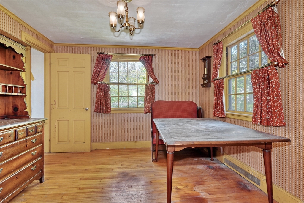 40 Lancaster Drive Westwood, MA 02090 - Photo 10 of 29 a dining room with furniture a rug and wooden floor
