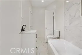 a bathroom with a bathtub and shower