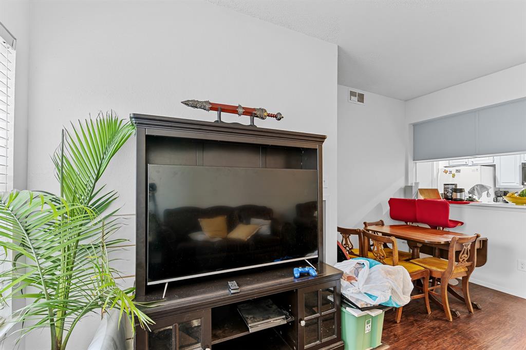 806 West 24th Street, Unit 214 Austin, TX 78705 - Photo 12 of 30 a living room with furniture and a flat screen tv