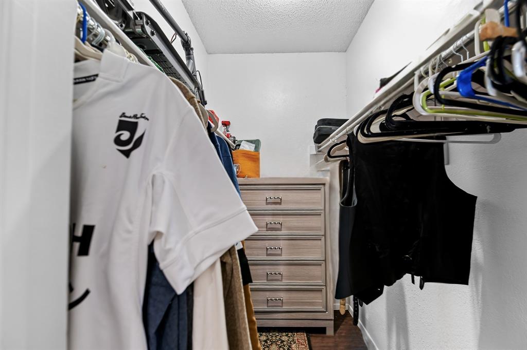 806 West 24th Street, Unit 214 Austin, TX 78705 - Photo 20 of 30 a view of walk in closet with clothes and shoes