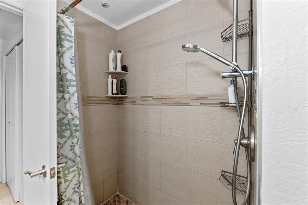 806 West 24th Street, Unit 214 Austin, TX 78705 - Photo 22 of 30 a bathroom with a shower