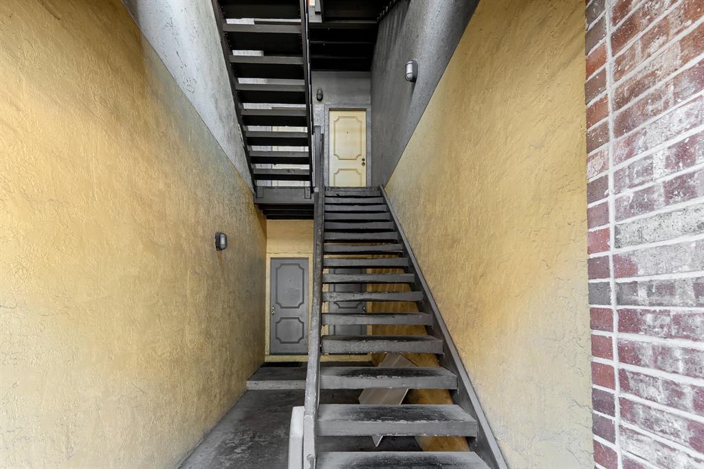 806 West 24th Street, Unit 214 Austin, TX 78705 - Photo 29 of 30 a view of a staircase and wooden floor